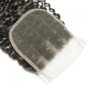 A lace closure hairpiece with curly hair texture.