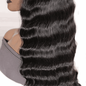 Close-up of long, wavy, shiny black hair cascading down a shoulder.